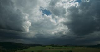 Link to Video | Saarland, rural area, Germany, time-lapse photography, 4K resolution, thunderstorm, agricultural land, hill, cloud, storm