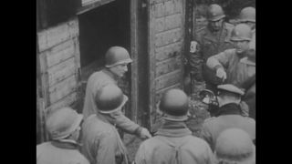 Link to Video | Liberation of Nazi camps, concentration camp, Buchenwald concentration camp, crime against humanity, Germany, The Holocaust, 1945, suffering, black and white