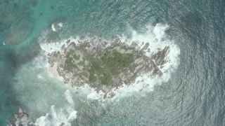 Link to Video | Seychelles, establishing shot, sea, island, 4K resolution, palm tree, high-angle shot, tropics, aerial shot, La Digue