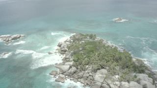 Link to Video | Seychelles, establishing shot, sea, island, 4K resolution, palm tree, high-angle shot, tropics, aerial shot, La Digue
