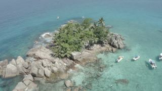 Link to Video | Seychelles, establishing shot, sea, island, 4K resolution, palm tree, high-angle shot, tropics, aerial shot, La Digue