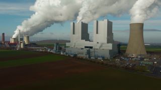 Link to Video | North Rhine-Westphalia, industrial building, smoke, energy supply, energy company, RWE Power, power station, environmental effects, Rhenish lignite mining area, environment, economic sector, Grevenbroich, building, aerial shot, particulates, sky, pollution, industrial sector, environmental protection