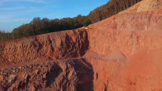 Link to Video | Geology, Rhineland-Palatinate, stone quarry, Taben-Rodt, excavator, Germany, manufacturing, quarry, mining and quarrying, mining company, mineral extraction, mining operations, dump truck, aerial shot, nonmetallic minerals industry, commercial vehicle, loading, industrial sector, mine, Trier-Saarburg