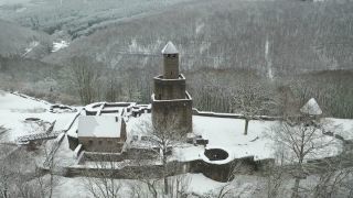 Link to Video | Burg Grimburg, cultural heritage monument in Germany, winter, castle ruin, Germany, castle, Hunsrück, aerial shot, Grimburg, snow, Trier-Saarburg