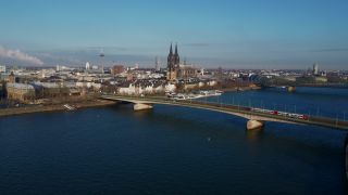 Link to Video | North Rhine-Westphalia, bridge, waterway, big city, Germany, Cologne, river, Europe, aerial shot, Rhine, urban district of North Rhine-Westphalia