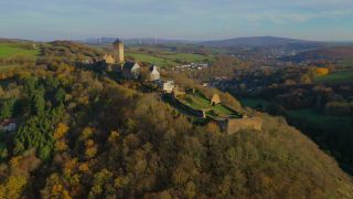 Link to Video | landscape, bird's-eye view, Rhineland-Palatinate, tourist destination, Thallichtenberg, physical location, Germany, castle, forest, Europe, aerial shot, Kusel, tourist attraction, human-made geographic feature, architectural structure, Kusel, Lichtenberg Castle, point of interest