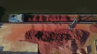 Link to Video | cargo ship, Saarland, cargo shipping, Saar, maritime transport, Merzig, logistics, excavator, Germany, loading, river, port, aerial shot, industrial sector