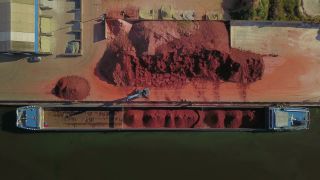 Link to Video | cargo ship, Saarland, cargo shipping, Saar, maritime transport, Merzig, logistics, excavator, Germany, loading, river, port, aerial shot, industrial sector