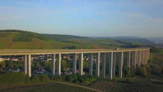 Link to Video | bird's-eye view, Rhineland-Palatinate, bridge, Verkehr, Germany, wine-producing region, vineyard, viticulture, aerial shot, transport, architectural structure, thoroughfare, Moselle Valley