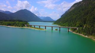 Link to Video | Upper Bavaria, landscape, bird's-eye view, bridge, Alps, reservoir, Germany, Sylvenstein Dam, mountain range, aerial shot, turquoise, Bavarian Alps, nature, Sylvensteinsee, Bavaria