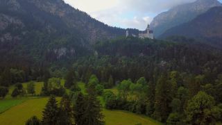 Link to Video | Swabia, landscape, bird's-eye view, tourist destination, Allgäu, Schwangau, Neuschwanstein Castle, mountain range, aerial shot, tourist attraction, nature, architectural structure, Bavaria