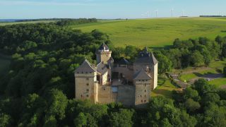 Link to Video | Lorraine, bird's-eye view, tourist destination, France, Manderen, castle, Château de Malbrouck, aerial shot, tourist attraction, architectural structure, point of interest