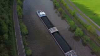 Link to Video | cargo ship, bird's-eye view, Rhineland-Palatinate, waterway, transport, cargo shipping, Saar, Germany, river, aerial shot, inland navigation, Kastel-Staadt, transport, thoroughfare, land waters, riverboat