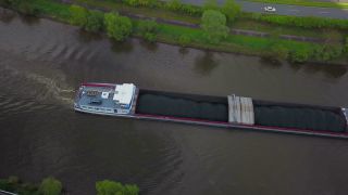 Link to Video | cargo ship, bird's-eye view, Rhineland-Palatinate, waterway, transport, cargo shipping, Saar, Germany, river, aerial shot, inland navigation, Kastel-Staadt, transport, thoroughfare, land waters, riverboat