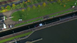 Link to Video | lock, cargo ship, bird's-eye view, canal, cargo shipping, Verkehr, hydraulic structure, mode of transport, barrage, watercourse, transport infrastructure, river, aerial shot, transport, thoroughfare