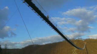 Link to Video | footbridge, landscape, Rhineland-Palatinate, tourist destination, bridge, suspension bridge, autumn, Hunsrück-Hochwald National Park, Germany, Geierlay, color, 4K resolution, landform, Hunsrück, footpath, simple suspension bridge, valley, forest, daytime, Kastellaun, tourist attraction, Sosberg, Mörsdorf, nature, architectural structure, thoroughfare, Rhein-Hunsrück-Kreis, point of interest