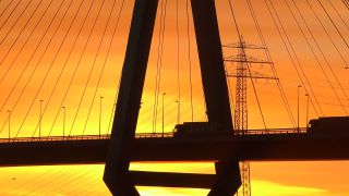 Link to Video | Hamburg, dawn, bridge, city-state, big city, million city, Verkehr, logistics, Germany, port settlement, Köhlbrand Bridge, Silhouette, red sky at morning, Köhlbrand, transport, morning, human-made geographic feature, architectural structure
