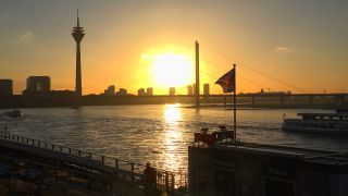 Link to Video | cargo ship, North Rhine-Westphalia, waterway, transport, cargo shipping, sunset, Düsseldorf, logistics, Germany, Rheinknie Bridge, river, Rhine, Rheinturm, thoroughfare