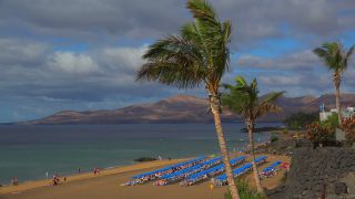 Link to Video | vacation, tourist destination, paid leave, sea, leisure, deckchair, seawater, recreation, Puerto del Carmen, Spain, beach, Visa Waiver Program, tourism, tourist, Canary Islands, travel, paid time off, Atlantic Ocean