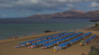 Link to Video | vacation, tourist destination, paid leave, sea, leisure, deckchair, seawater, recreation, Puerto del Carmen, Spain, beach, Visa Waiver Program, tourism, tourist, Canary Islands, travel, paid time off, Atlantic Ocean