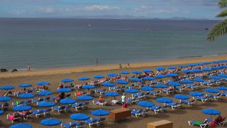 Link to Video | vacation, tourist destination, paid leave, sea, leisure, deckchair, seawater, recreation, Puerto del Carmen, Spain, beach, Visa Waiver Program, tourism, tourist, Canary Islands, travel, paid time off, Atlantic Ocean
