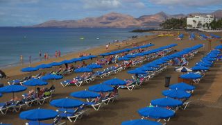 Link to Video | vacation, tourist destination, paid leave, sea, leisure, deckchair, seawater, recreation, Puerto del Carmen, Spain, beach, Visa Waiver Program, tourism, tourist, Canary Islands, travel, paid time off, Atlantic Ocean