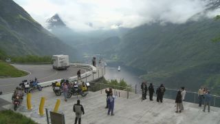 Link to Video | Geiranger, landscape, tourist destination, West Norwegian Fjords – Geirangerfjord and Nærøyfjord, body of water, cruise, Geirangerfjord, Norway, Scandinavia, natural heritage, cruise ship, fjord, Nordic countries, tourist attraction, transport, UNESCO World Heritage Site