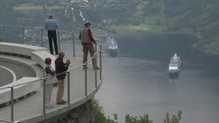 Link to Video | Geiranger, landscape, tourist destination, West Norwegian Fjords – Geirangerfjord and Nærøyfjord, body of water, cruise, Geirangerfjord, Norway, Scandinavia, natural heritage, cruise ship, fjord, Nordic countries, tourist attraction, transport, UNESCO World Heritage Site