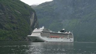 Link to Video | Geiranger, landscape, tourist destination, West Norwegian Fjords – Geirangerfjord and Nærøyfjord, body of water, cruise, Geirangerfjord, Norway, Scandinavia, natural heritage, cruise ship, fjord, Nordic countries, tourist attraction, transport, UNESCO World Heritage Site