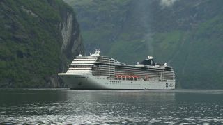 Link to Video | Geiranger, landscape, vacation, tourist destination, West Norwegian Fjords – Geirangerfjord and Nærøyfjord, body of water, cruise, leisure, Geirangerfjord, Norway, Scandinavia, natural heritage, cruise ship, fjord, Nordic countries, tourist attraction, paid time off, transport, UNESCO World Heritage Site