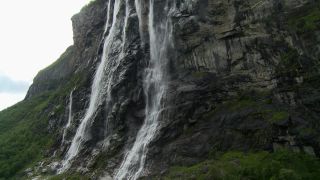 Link to Video | Geiranger, landscape, tourist destination, West Norwegian Fjords – Geirangerfjord and Nærøyfjord, body of water, cruise, Geirangerfjord, Norway, Scandinavia, natural heritage, cruise ship, fjord, Nordic countries, tourist attraction, transport, UNESCO World Heritage Site