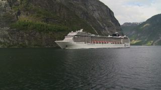 Link to Video | Geiranger, landscape, tourist destination, West Norwegian Fjords – Geirangerfjord and Nærøyfjord, body of water, cruise, Geirangerfjord, Norway, Scandinavia, natural heritage, cruise ship, fjord, Nordic countries, tourist attraction, transport, UNESCO World Heritage Site
