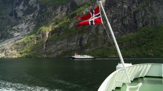Link to Video | Geiranger, landscape, tourist destination, West Norwegian Fjords – Geirangerfjord and Nærøyfjord, body of water, cruise, Geirangerfjord, Norway, Scandinavia, natural heritage, cruise ship, fjord, Nordic countries, tourist attraction, transport, UNESCO World Heritage Site