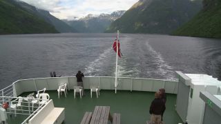 Link to Video | Geiranger, landscape, tourist destination, West Norwegian Fjords – Geirangerfjord and Nærøyfjord, body of water, cruise, Geirangerfjord, Norway, Scandinavia, natural heritage, cruise ship, fjord, Nordic countries, tourist attraction, transport, UNESCO World Heritage Site