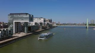 Link to Video | cargo ship, fairway, canal, waterway, body of water, big city, logistics, drainage system, high-angle shot, transport infrastructure, river, inland navigation, city, natural watercourse, transport, thoroughfare
