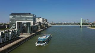 Link to Video | cargo ship, fairway, canal, waterway, body of water, big city, logistics, drainage system, high-angle shot, transport infrastructure, river, inland navigation, city, natural watercourse, transport, thoroughfare