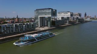 Link to Video | cargo ship, fairway, canal, waterway, body of water, big city, logistics, drainage system, high-angle shot, transport infrastructure, river, inland navigation, city, natural watercourse, transport, thoroughfare