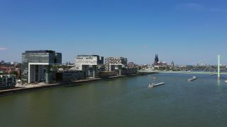 Link to Video | cargo ship, fairway, canal, waterway, body of water, big city, logistics, drainage system, high-angle shot, transport infrastructure, river, inland navigation, city, natural watercourse, transport, thoroughfare