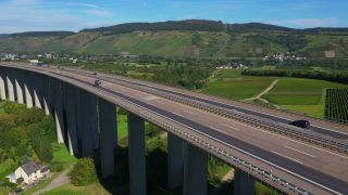 Link to Video | landscape, architecture, bridge, landscape element, private transport, Germany, Schengen Area, landform, Central Europe, road transport infrastructure, building type, traffic, controlled-access highway, geographical feature, transport, human-made geographic feature, human-made geographic feature, architectural structure, thoroughfare, Bundesautobahn 1, mobility