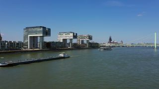 Link to Video | cargo ship, fairway, canal, waterway, body of water, big city, logistics, drainage system, high-angle shot, transport infrastructure, river, inland navigation, city, natural watercourse, transport, thoroughfare