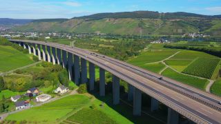 Link to Video | landscape, architecture, bridge, landscape element, private transport, Germany, Schengen Area, landform, Central Europe, road transport infrastructure, building type, traffic, controlled-access highway, geographical feature, transport, human-made geographic feature, human-made geographic feature, architectural structure, thoroughfare, Bundesautobahn 1, mobility