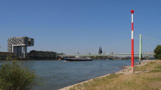 Link to Video | cargo ship, fairway, canal, waterway, body of water, big city, logistics, drainage system, high-angle shot, transport infrastructure, river, inland navigation, city, natural watercourse, transport, thoroughfare