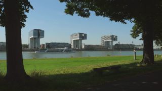 Link to Video | cargo ship, fairway, canal, waterway, body of water, big city, logistics, drainage system, high-angle shot, transport infrastructure, river, inland navigation, city, natural watercourse, transport, thoroughfare