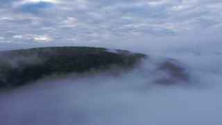 Link to Video | landscape, bird's-eye view, territorial entity, landscape element, meteorological phenomenon, landform, high-angle shot, fog, forest, aerial shot, nature, cloud
