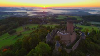 Link to Video | landscape, bird's-eye view, tourist destination, time of the day, landscape element, castle ruin, Nürburg Castle, terrain, sunrise, landform, Eifel (Rhineland-Palatinate), Europe, aerial shot, Adenau, tourist attraction, Nürburg, human-made geographic feature, architectural structure, Ahrweiler, point of interest