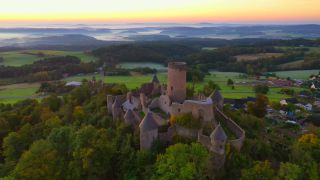 Link to Video | landscape, bird's-eye view, tourist destination, time of the day, landscape element, castle ruin, Nürburg Castle, terrain, sunrise, landform, Eifel (Rhineland-Palatinate), Europe, aerial shot, Adenau, tourist attraction, Nürburg, human-made geographic feature, architectural structure, Ahrweiler, point of interest