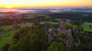 Link to Video | landscape, bird's-eye view, tourist destination, time of the day, landscape element, castle ruin, Nürburg Castle, terrain, sunrise, landform, Eifel (Rhineland-Palatinate), Europe, aerial shot, Adenau, tourist attraction, Nürburg, human-made geographic feature, architectural structure, Ahrweiler, point of interest