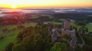 Link to Video | landscape, bird's-eye view, tourist destination, time of the day, landscape element, castle ruin, Nürburg Castle, terrain, sunrise, landform, Eifel (Rhineland-Palatinate), Europe, aerial shot, Adenau, tourist attraction, Nürburg, human-made geographic feature, architectural structure, Ahrweiler, point of interest