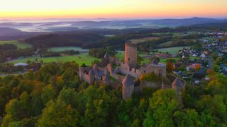 Link to Video | landscape, bird's-eye view, tourist destination, time of the day, landscape element, castle ruin, Nürburg Castle, terrain, sunrise, landform, Eifel (Rhineland-Palatinate), Europe, aerial shot, Adenau, tourist attraction, Nürburg, human-made geographic feature, architectural structure, Ahrweiler, point of interest