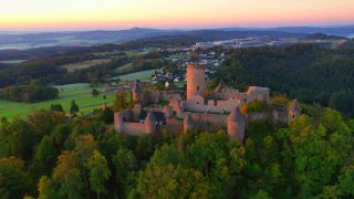 Link to Video | landscape, bird's-eye view, tourist destination, time of the day, landscape element, castle ruin, Nürburg Castle, terrain, sunrise, landform, Eifel (Rhineland-Palatinate), Europe, aerial shot, Adenau, tourist attraction, Nürburg, human-made geographic feature, architectural structure, Ahrweiler, point of interest